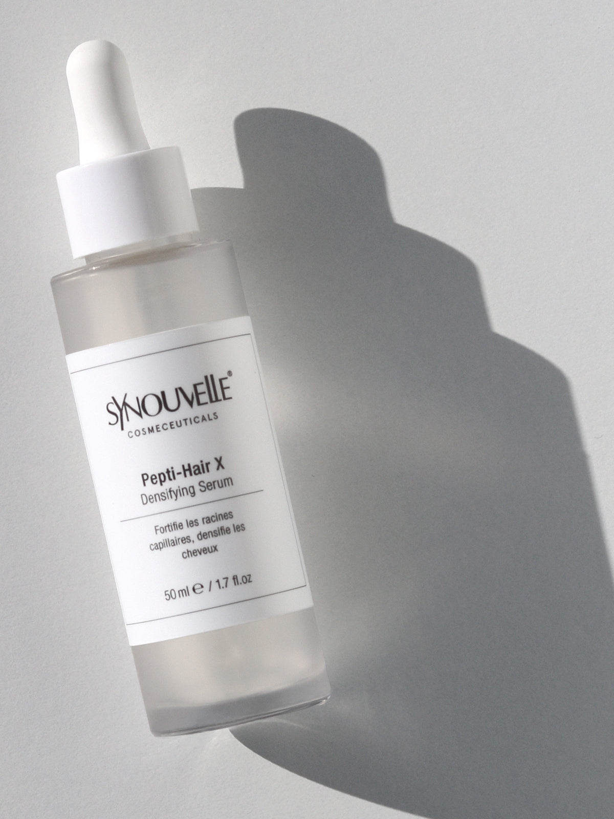 Close-up of Pepti-Hair X Serum – lightweight, oil-free texture designed for targeted scalp application